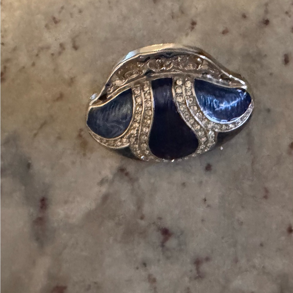 A blue and silver coin purse with clear crystals